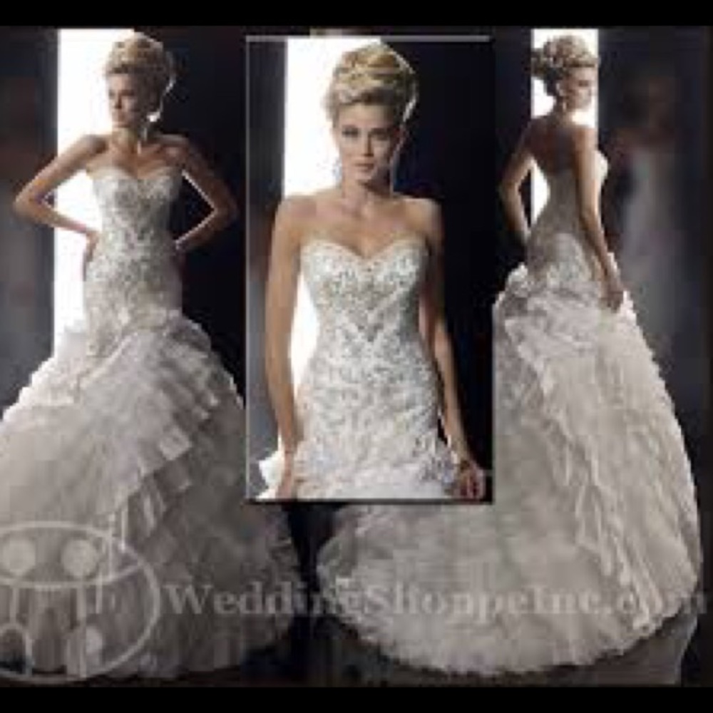 Christina Wu wedding dress<SHARE>size 4 with corset added for adjustment